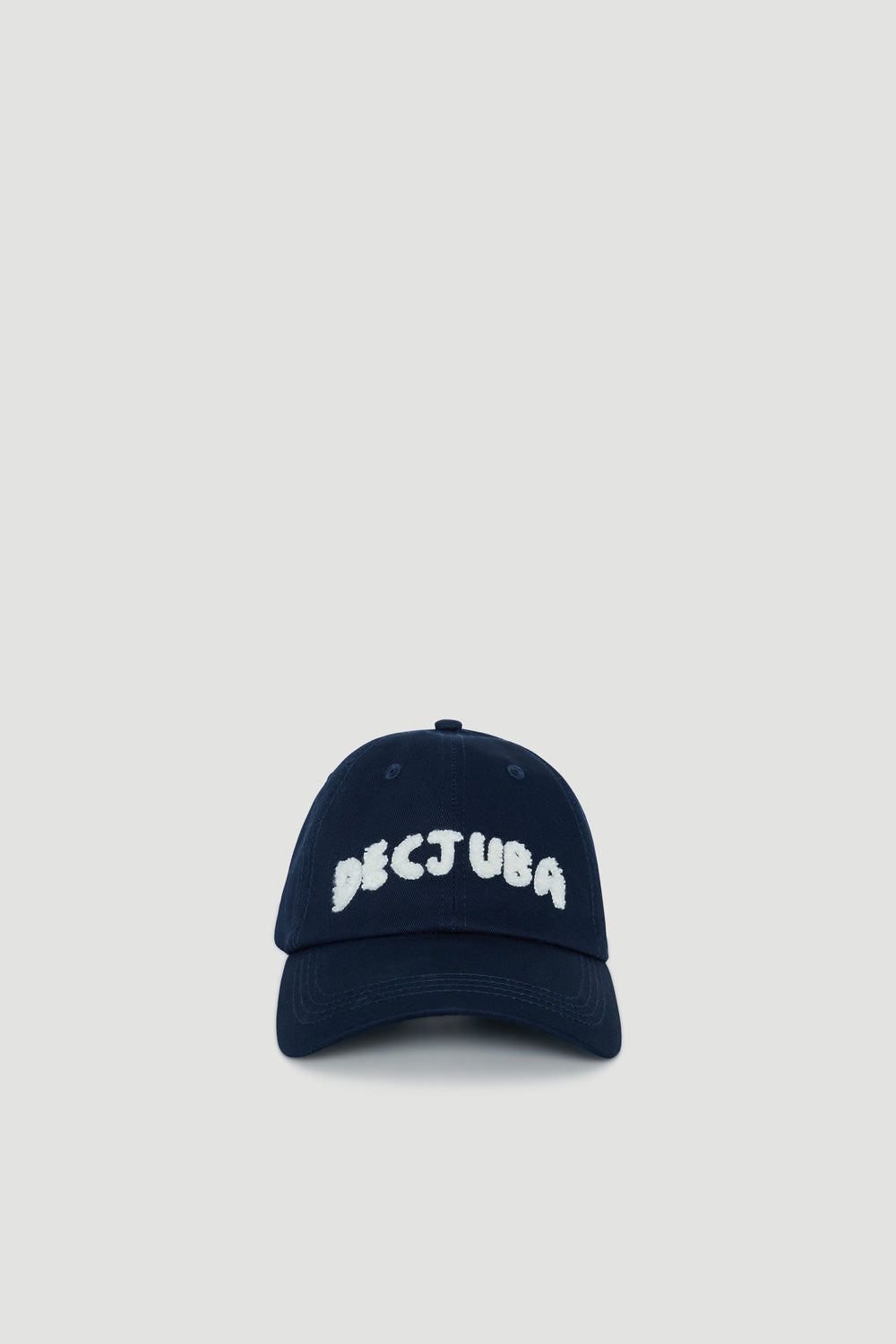 Navy blue cap for girls with white textured lettering and a curved brim for casual everyday wear
