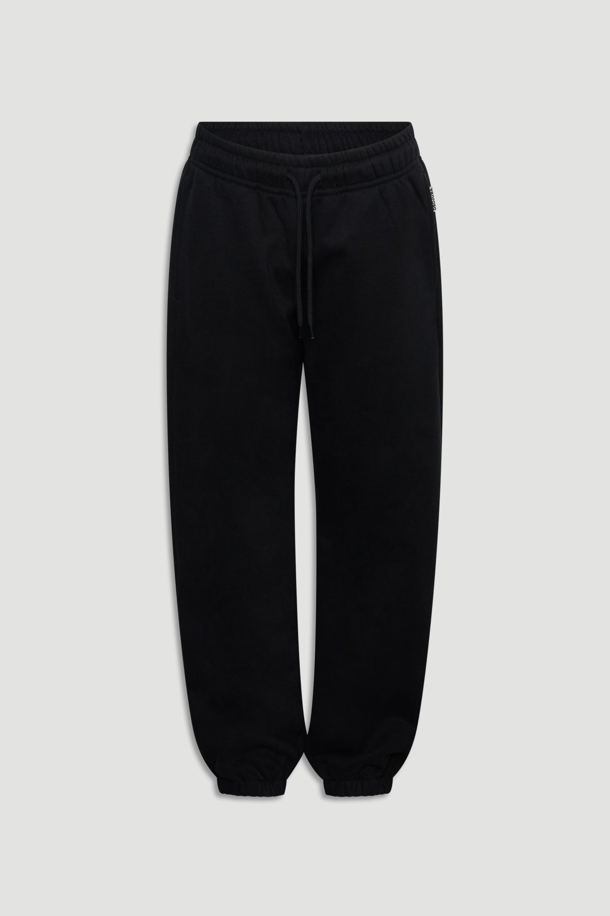 Classic black track pants for girls with elastic cuffs and a comfortable drawstring waist for easy wear.