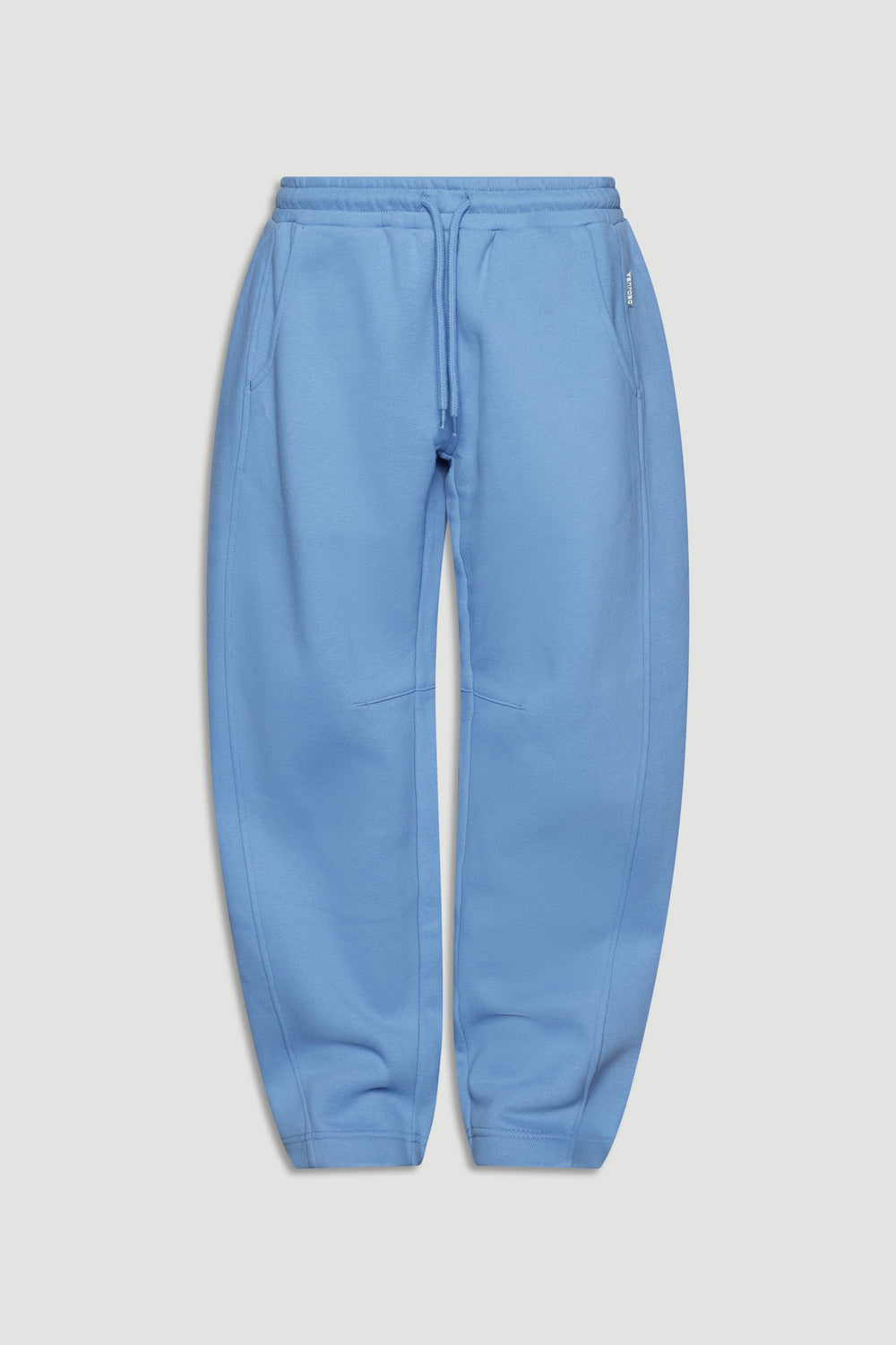 Dusty blue relaxed barrel leg pants for girls with elastic waistband and drawstring detail, styled for comfort and ease.