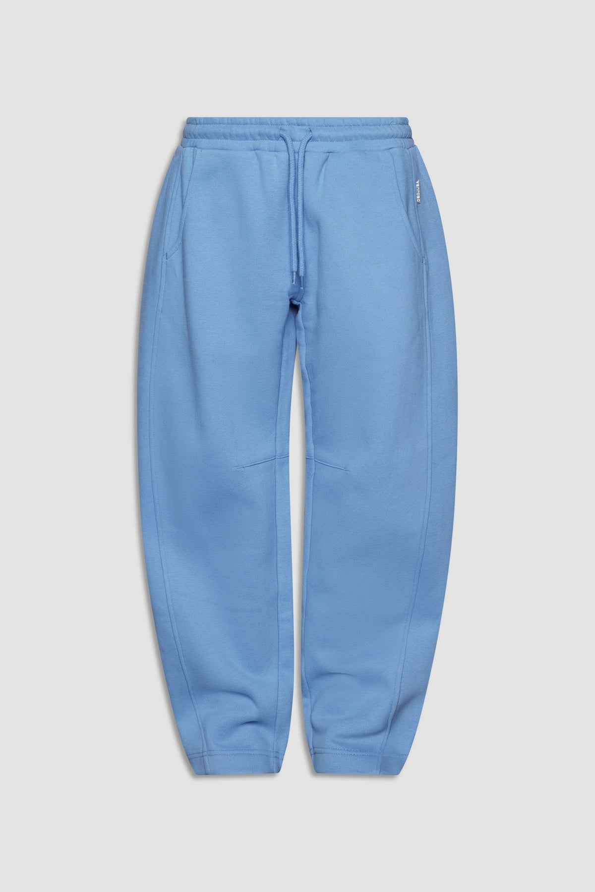 Dusty blue relaxed barrel leg pants for girls with elastic waistband and drawstring detail, styled for comfort and ease.