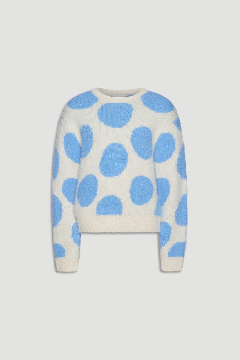 Soft cream knit jumper with large sky blue spots, featuring a cozy fluffy texture and relaxed fit for girls.