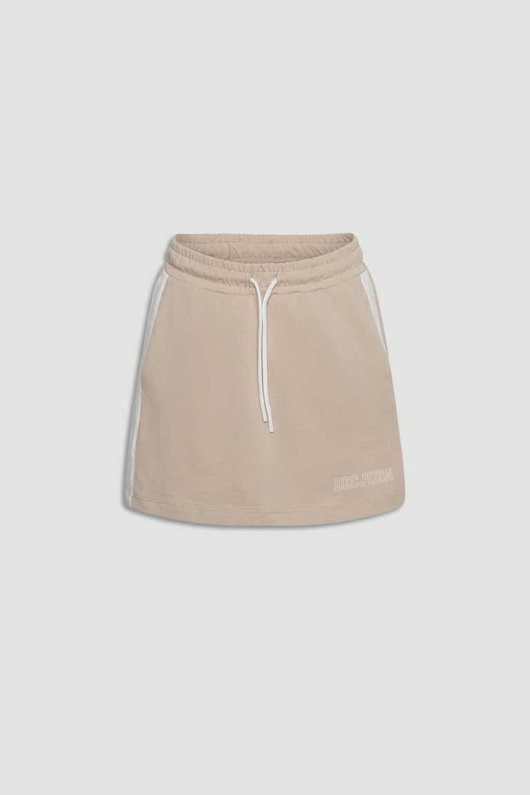 Beige girls' pull-on skirt with elastic waistband, side pockets, white drawstring, and subtle logo detail at hem.
