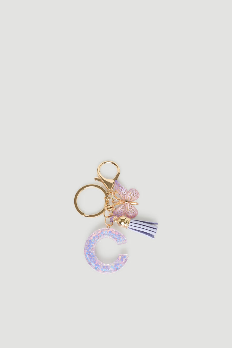 Girls Initial Key Ring featuring a glittery letter C charm, delicate butterfly, and tassel detail by DECJUBA.