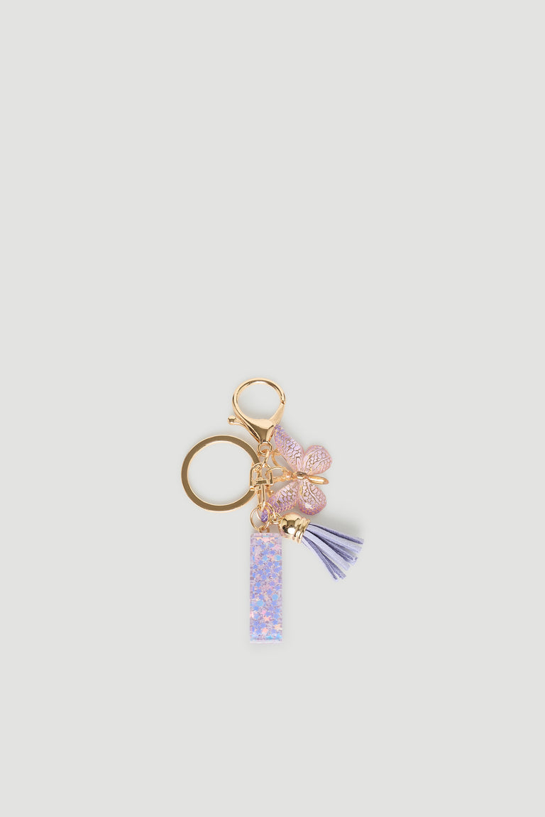 Girls Initial Key Ring with pastel purple letter charm, butterfly detail, and soft tassel for playful accessory style.
