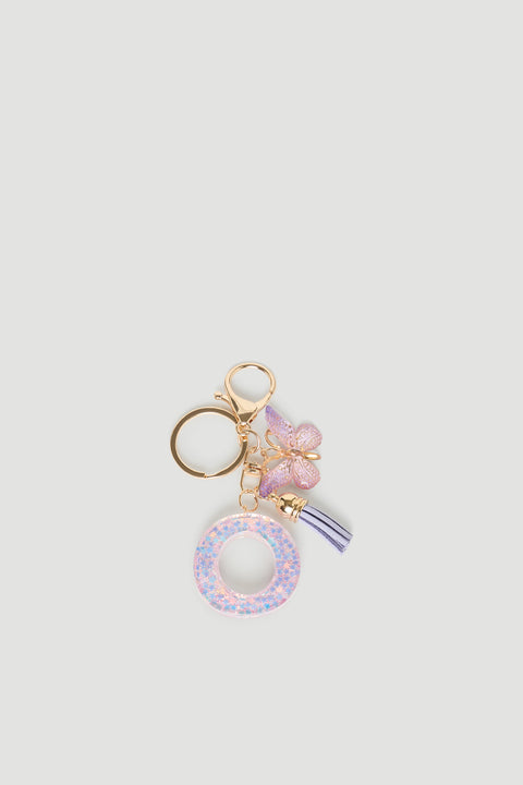 Girls Initial Key Ring featuring a glittery pastel letter O, delicate butterfly charm, and soft lilac tassel detail by DECJUBA.