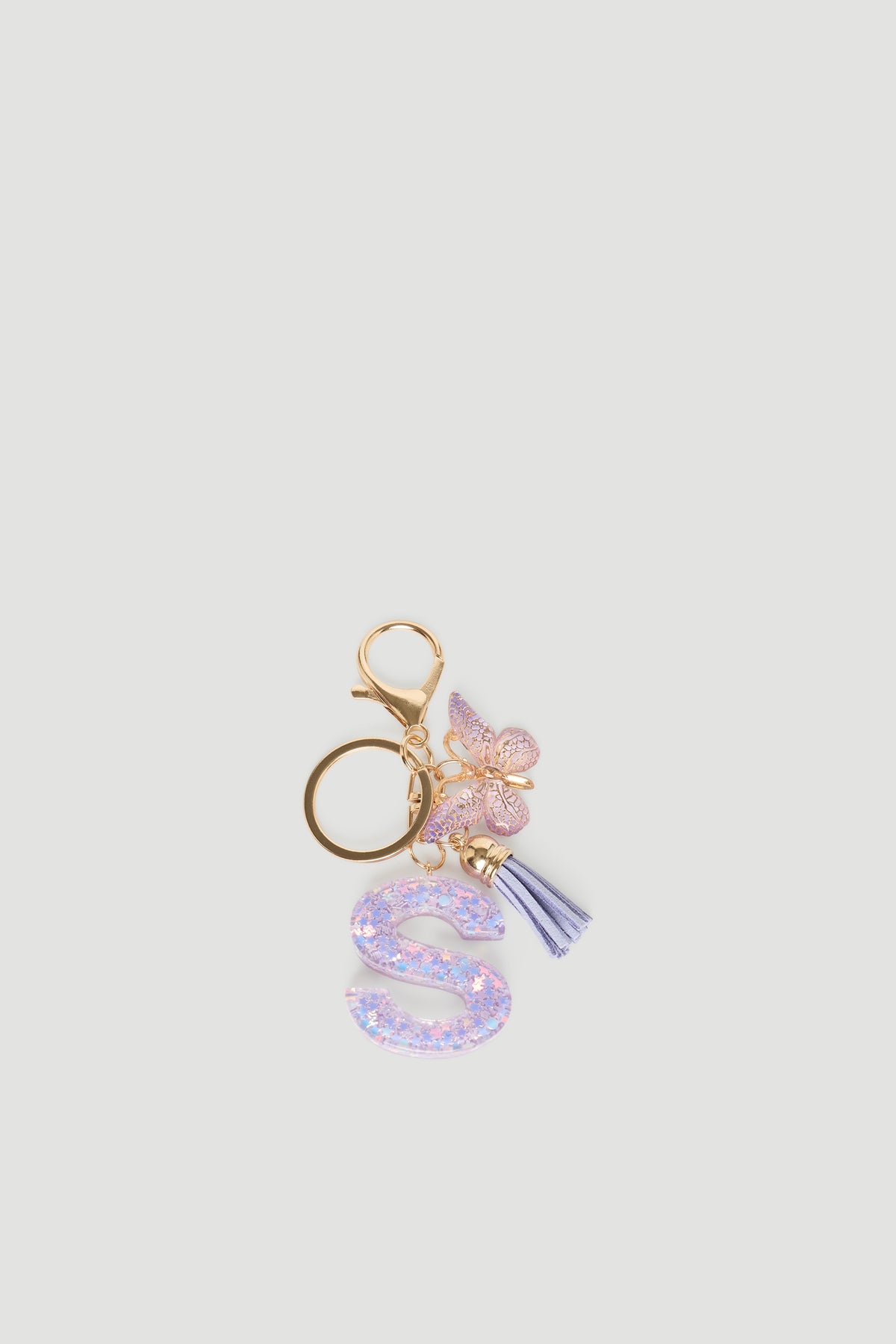 Girls Initial Key Ring with glittery purple letter S, delicate butterfly charm, and soft lilac tassel by DECJUBA.