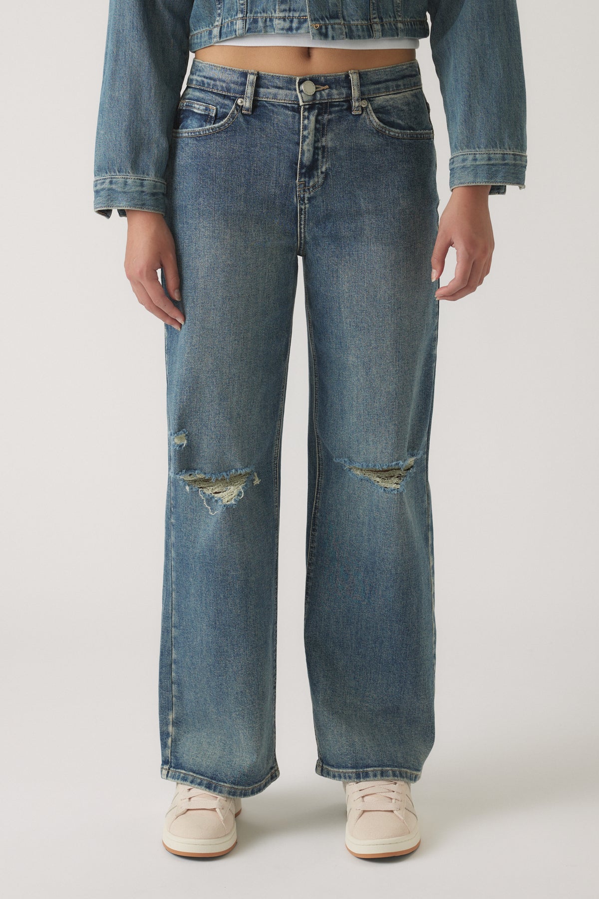 Girls Gigi Baggy Ripped Jean in medium blue denim with distressed knee details and relaxed wide-leg fit for casual style.
