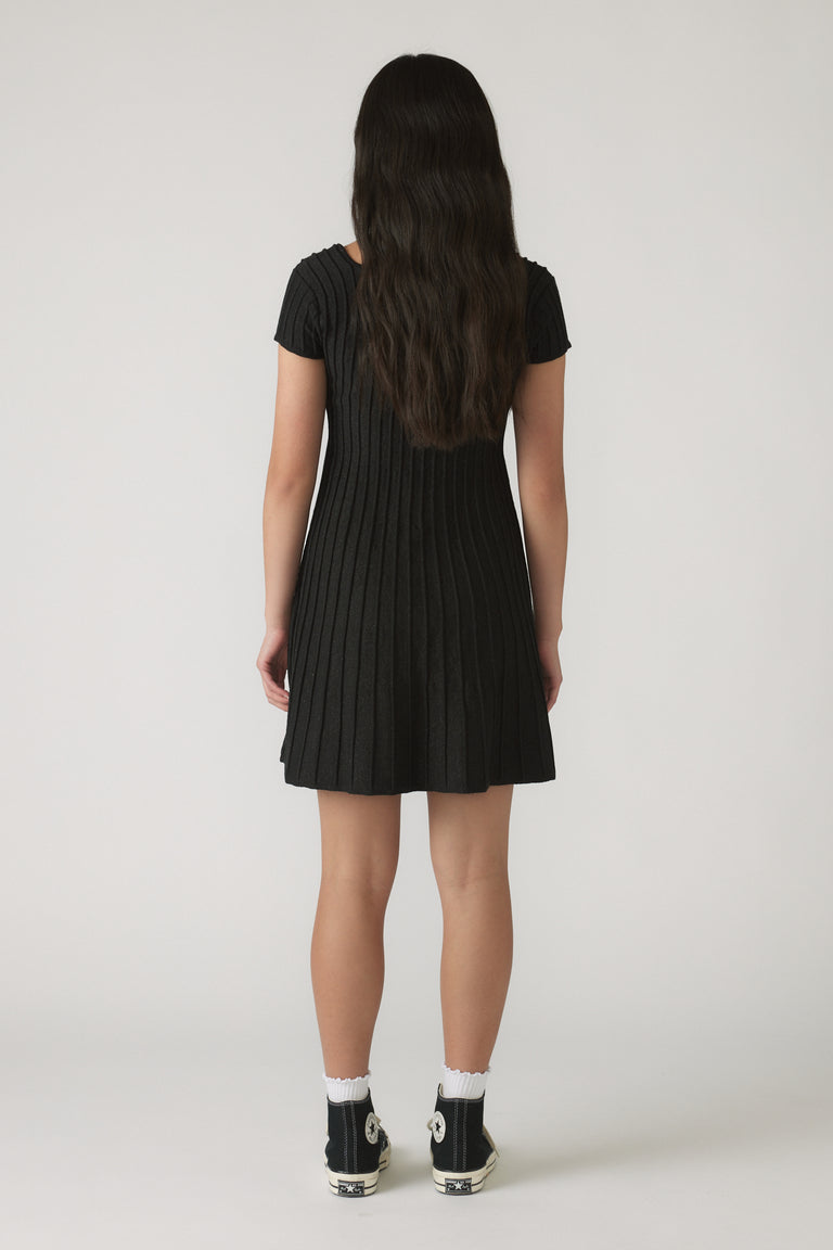 Back view of Girls Gemma Knit Dress in black ribbed knit with short sleeves and a flared skirt silhouette