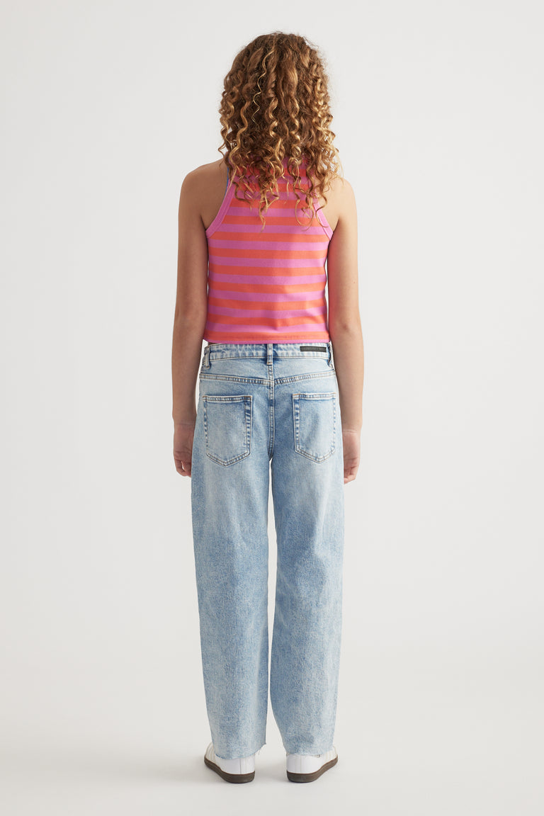 Back view of girl wearing a pink striped rib racer tank with light wash wide leg jeans