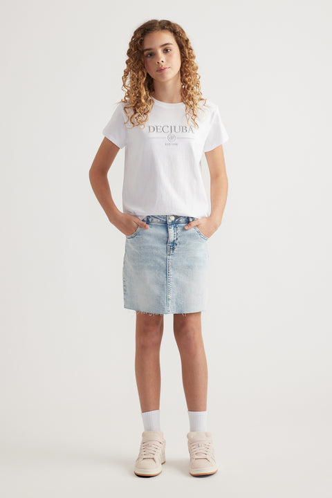 Girl wearing a white heritage graphic tee with a round hem, denim skirt and high top sneakers