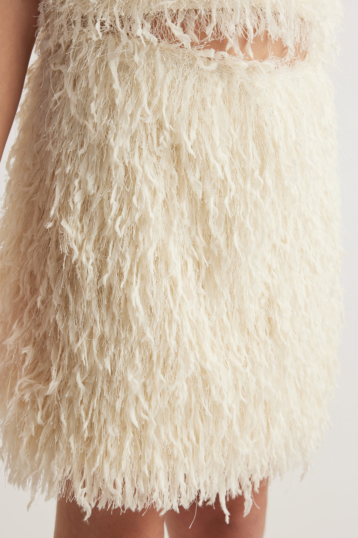 Cream textured party skirt with a high elasticated waist and above-knee hem