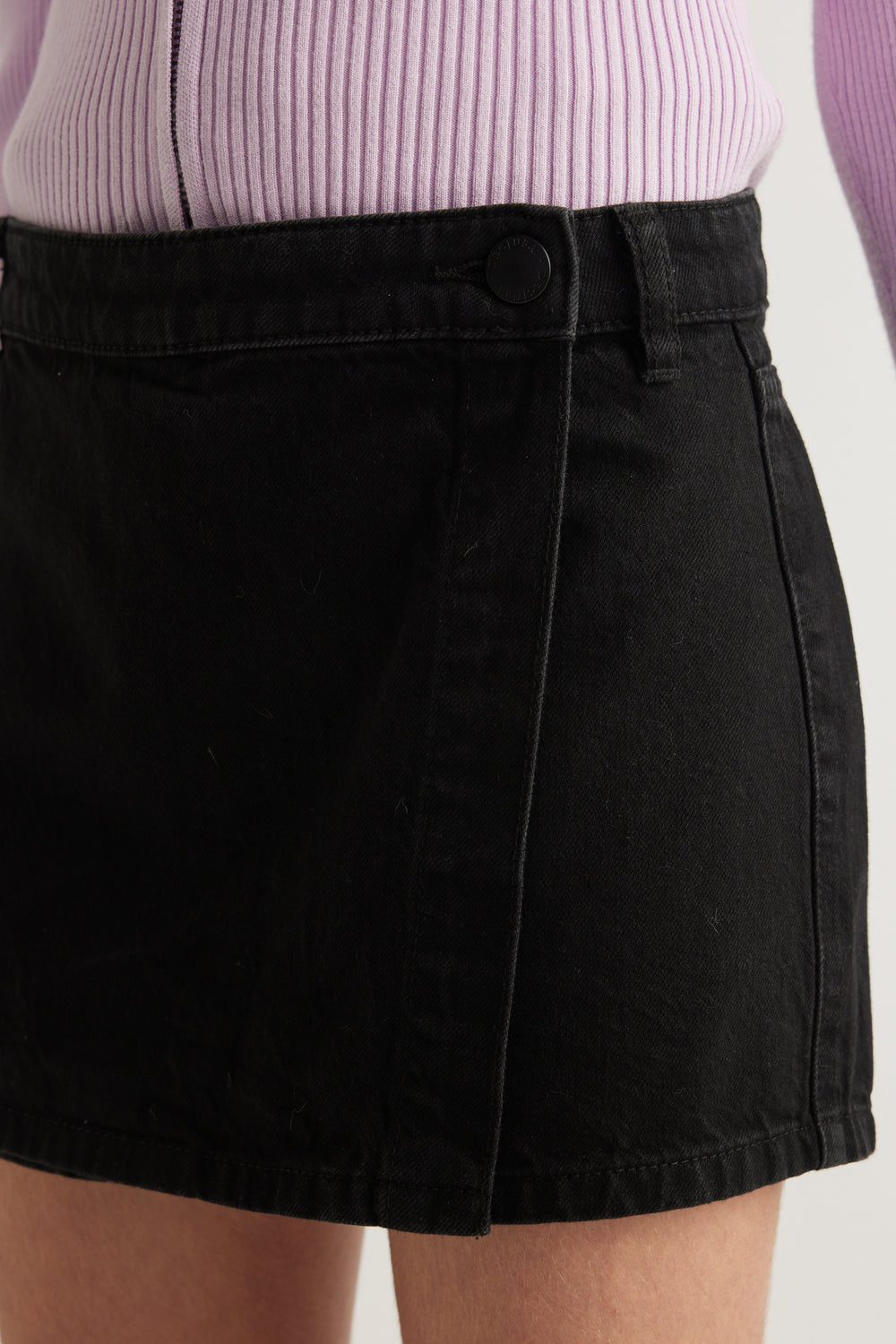 Girls black denim skort with wrap front and button closure