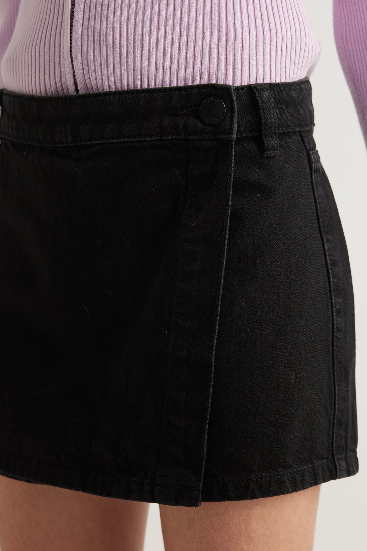 Girls black denim skort with wrap front and button closure