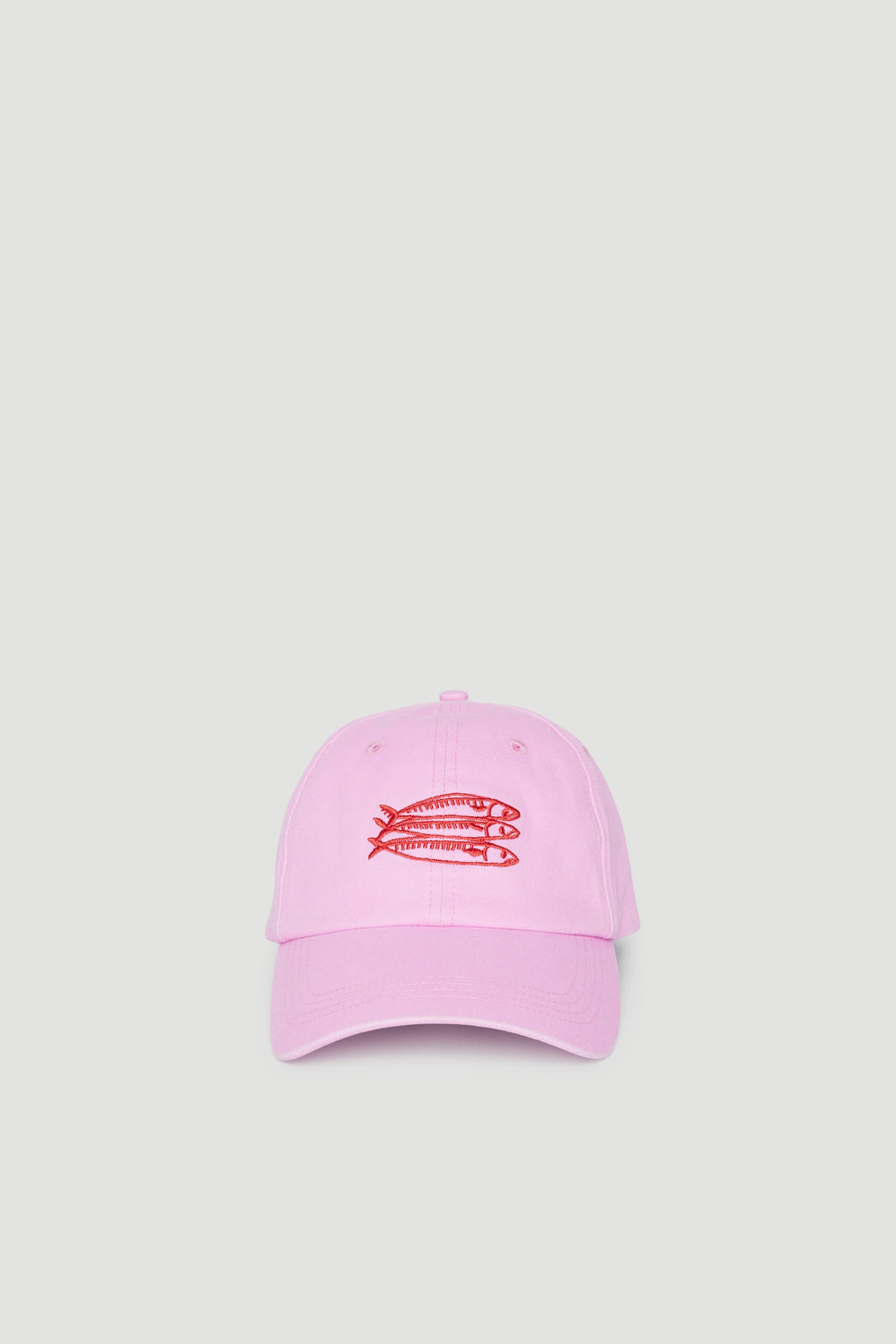 Pink girls cap with a red sardine motif and silver hardware