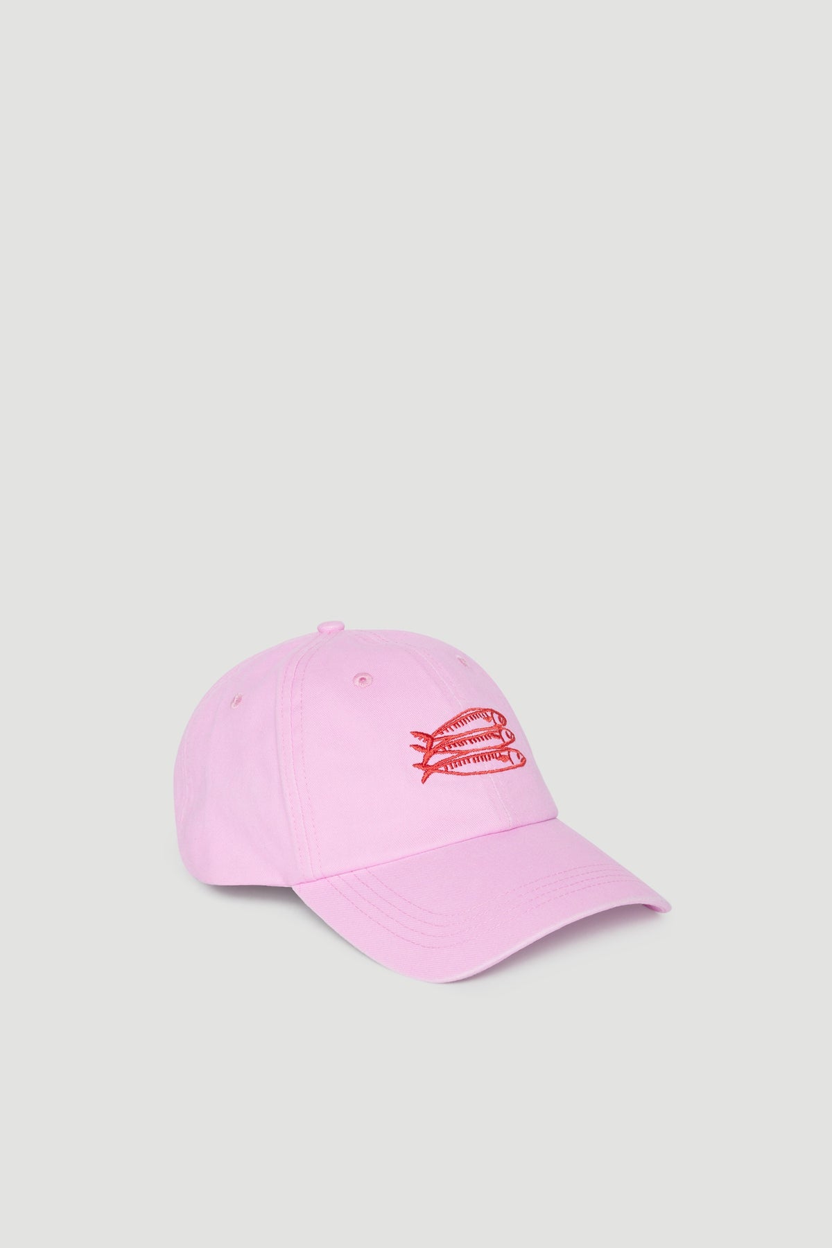 Pink girls cap with red sardine motif and curved brim
