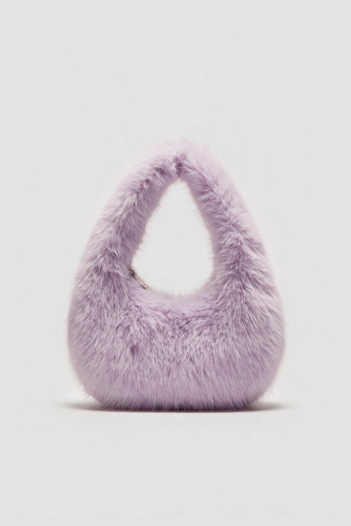Lavender fluffy shoulder bag with a soft plush finish and rounded top handle